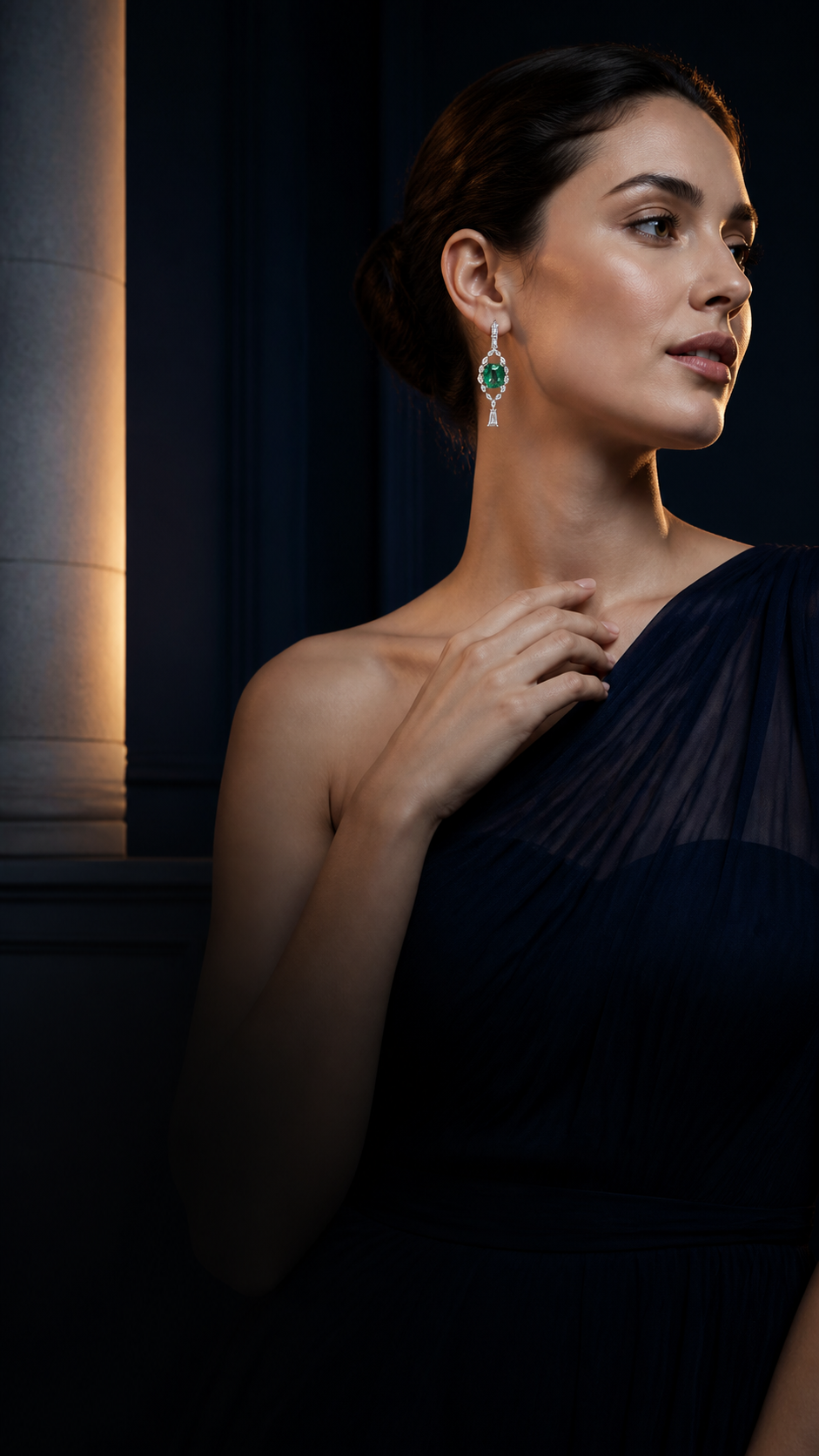A woman wearing exceptional emerald and diamond earrings